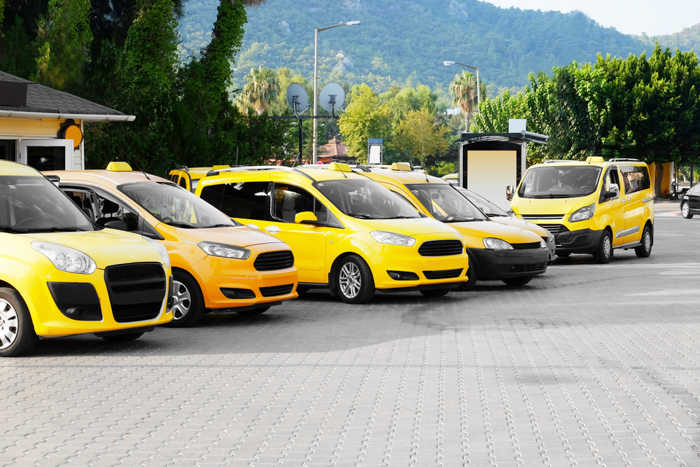 Taxi cars standing in parking zone